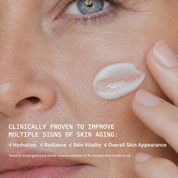 Close-up of a woman’s cheek with Odacité Cellular Infusion Cream • NAD+ Biomimetic Peptides showing smooth, hydrated skin.
