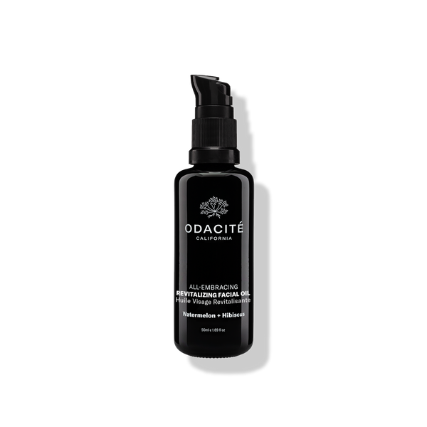 Black Odacite All-Embracing Watermelon + Hibiscus Revitalizing Facial Oil bottle on a plain light background.