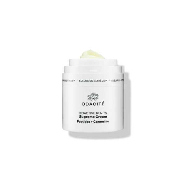 White jar of Odacité Bioactive Renew Supreme Cream with Edelweiss Extrême, Peptides, and Carnosine; cream visible at the top.