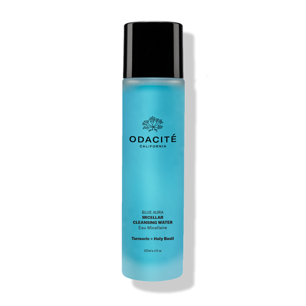 Blue bottle of Odacité Blue Aura Turmeric + Holy Basil Micellar Cleansing Water with black cap and labeled front.