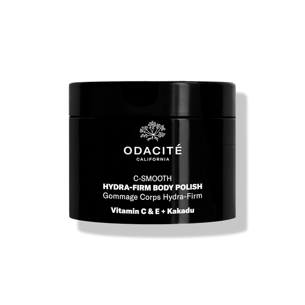 Odacité C-Smooth • Hydra-Firm Body Polish with Vitamin C & E + Kakadu in a black jar against a white background.