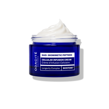 Odacité Cellular Infusion Cream NAD+ Biomimetic Peptides, open jar with white cream visible, on a white background.