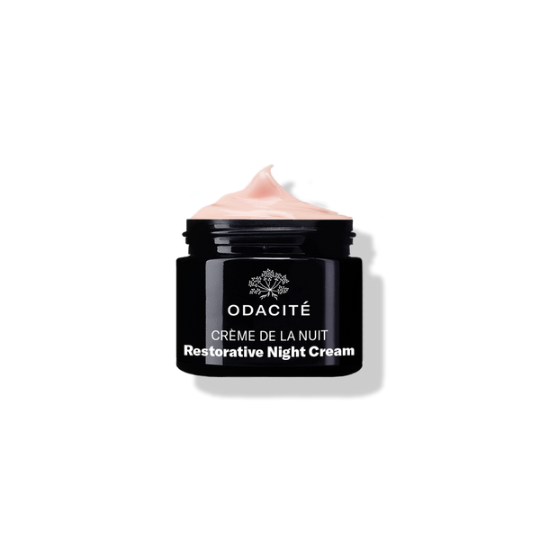 Black Odacite Crème de la Nuit Vitamin C + Ashwagandha night cream jar with visible light pink cream inside.