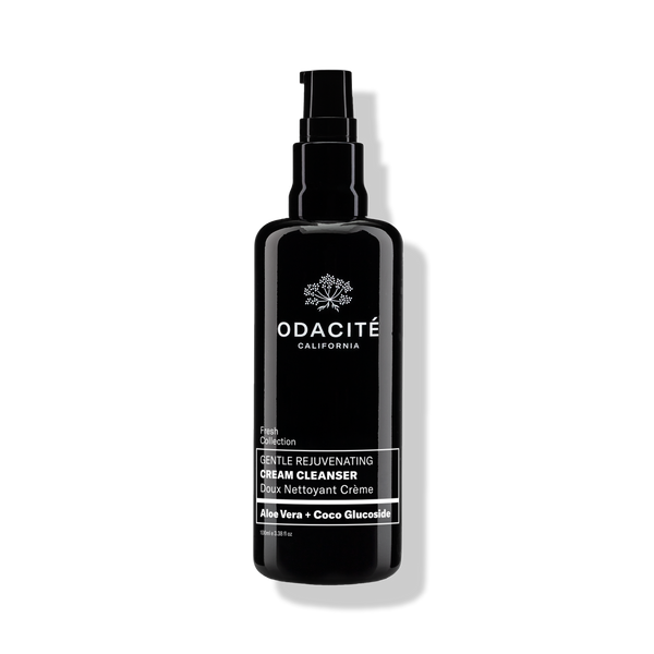 Black bottle of Odacite Gentle Rejuvenating Cream Cleanser with Aloe Vera + Coco Glucoside on a plain white background.