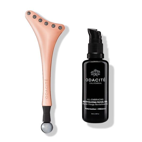 Odacité Ice-Lift Facial Cryotherapy Duo and All-Embracing Revitalizing Oil bottles on a plain white background.