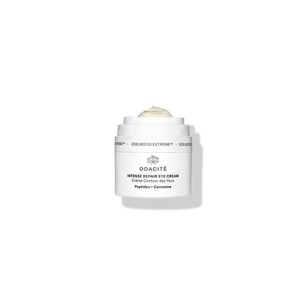 Odacité Intense Repair Eye Cream • Edelweiss Extrême® jar with lid off, showing pale cream inside against a white background.