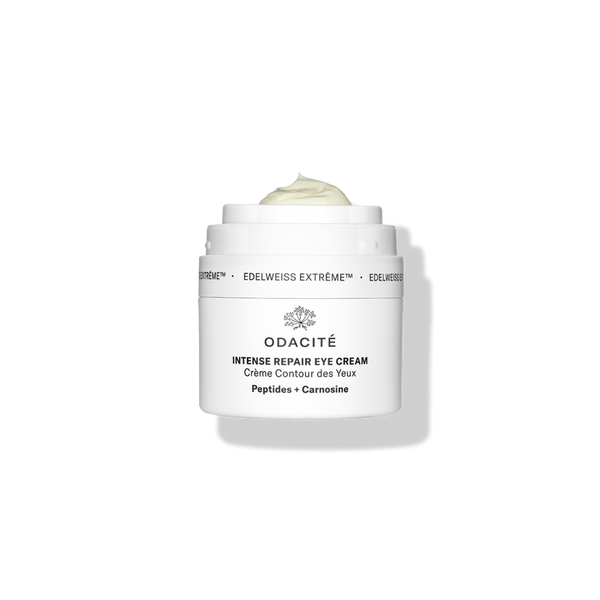 White jar of Odacité Edelweiss Extrême Skin Barrier Set with cream visible inside the open container.