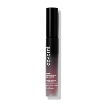 Odacité SPF 40 Nourishing Lip Serum in a black tube, upright against a plain white background.