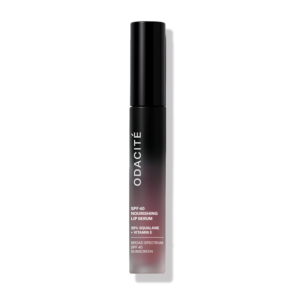 Odacité SPF 40 Nourishing Lip Serum in a black tube, upright against a plain white background.