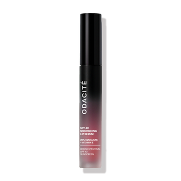 Odacité SPF 40 Nourishing Lip Serum in a black-to-red gradient tube with white text, standing upright on a white background.