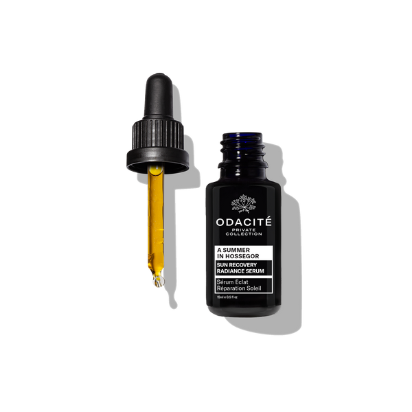 Odacite Corrective Repair Serum • A Summer in Hossegor shown as a golden liquid in a clear dropper bottle.