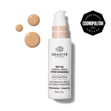 Odacité SPF 50 Tinted Mineral Drops with Niacinamide + Green Tea and a Cosmopolitan Clean Beauty Awards 2023 badge on packaging.