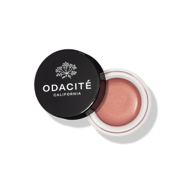 Odacite blush in a black container on a white background