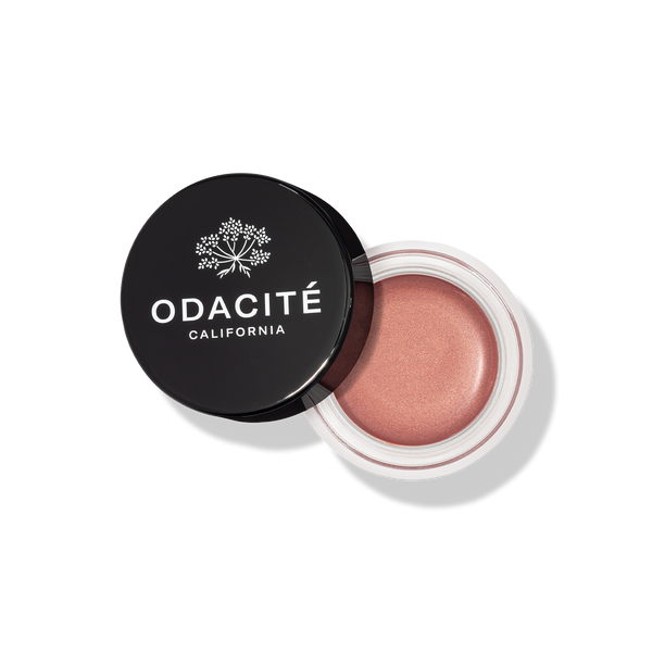 Odacite blush in a black container on a white background