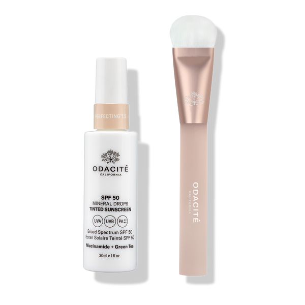 Odacité SPF Tinted Mineral Drops & Brush Duo with sunscreen drops and a soft brush featuring a metallic pink handle.