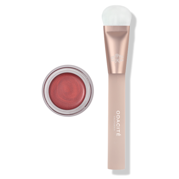 Makeup product with applicator on a white background