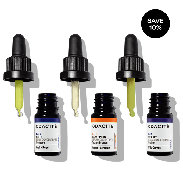 Odacité Skin Glow Serum Set with three glass dropper bottles, each containing a different colored serum.