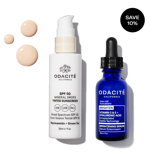 Odacité Sun Damage Defense Duo SPF 50 and Vitamin C bottles on a white background with visible lotion drops.