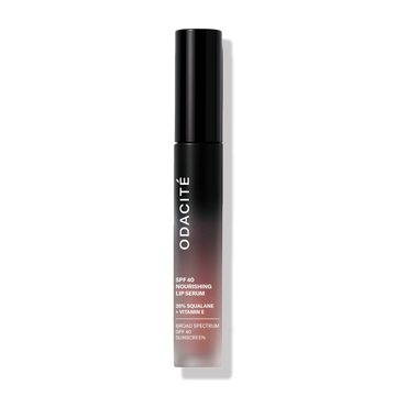 Odacité SPF 40 Nourishing Lip Serum in a black tube on a plain white background.