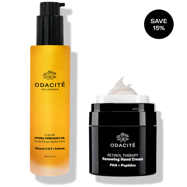 Odacité Vitamin C & Retinol Targeted Body Essentials set with a body oil in a pump bottle and hand cream in a black jar.