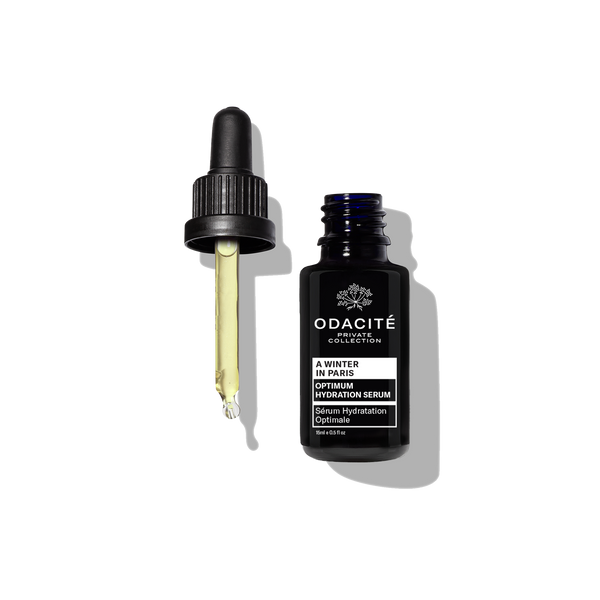 Odacite Optimum Hydration • A Winter in Paris serum bottle with camellia seed oil and dropper on a white background.