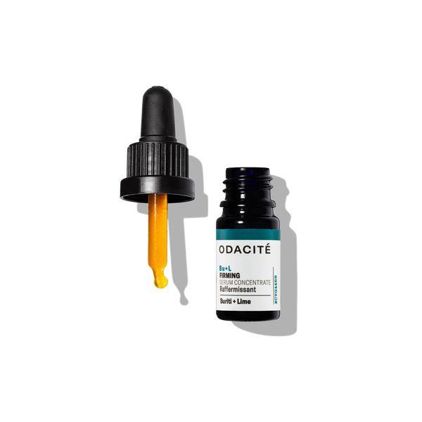 Odacite Firming Buriti + Lime Bu+L Serum Concentrate in a dark dropper bottle with yellow serum on a white background.
