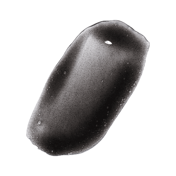 Odacite Black Mint Charcoal + Rhassoul Clarifying Cleanser gel with bubbles on a plain white background.
