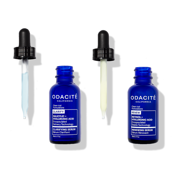 Two blue Odacité Let's Be Clear Power Duo serum bottles with droppers, labeled Salicylic Acid and Encapsulated Retinol.