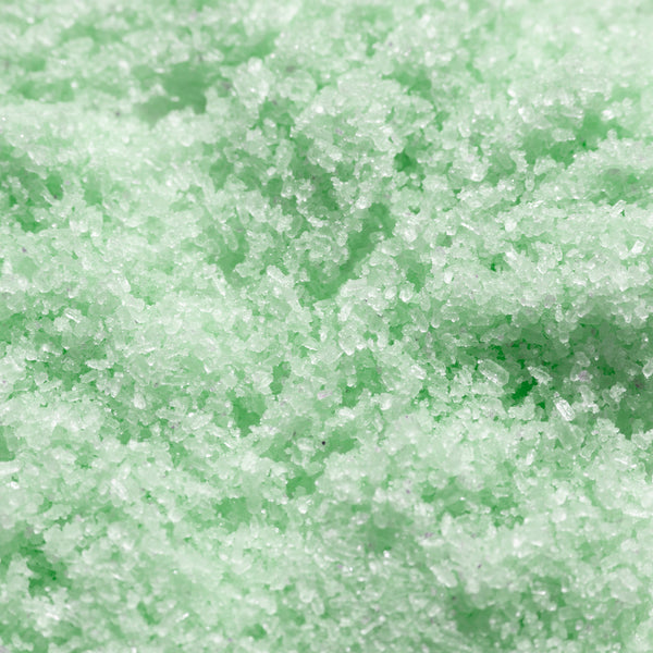 Odacite Energy Awakening Himalayan Bath Soak with visible crystal salt, rosemary, and eucalyptus in clear packaging.