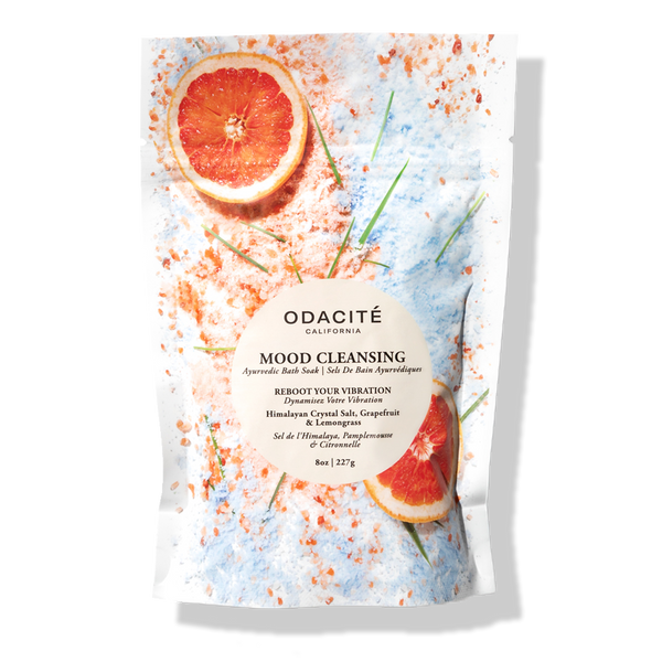 Odacité Mood Cleansing Bath Soak with Himalayan Crystal Salt, Grapefruit & Lemongrass in bright orange and yellow citrus-themed packaging.