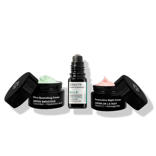 Odacité Like Night & Day Results Kit with green and pink face creams and a roll-on serum, all on a white background.