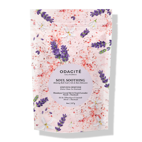Odacite Soul Soothing Bath Soak with Himalayan salt, French lavender, neroli, and patchouli on a pink background.