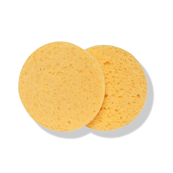 Odacite Facial Sponges, 2 sets of 2 round yellow biodegradable sponges with porous texture on a white background.