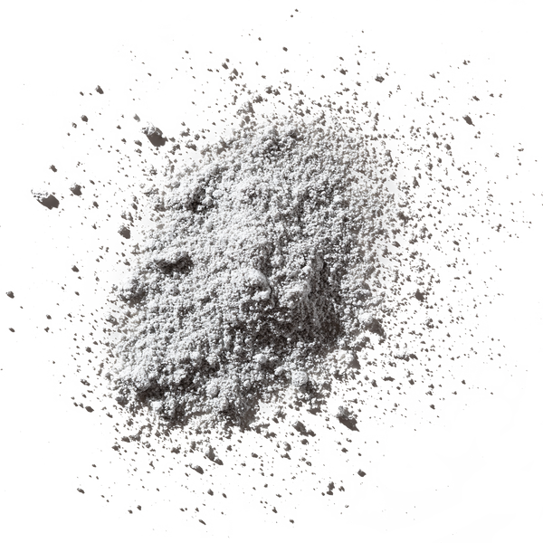 Odacite Synergie[4] Probiotics + Fruit Acids 4-IN-1 Powder Masque, loose powder scattered on a white surface.