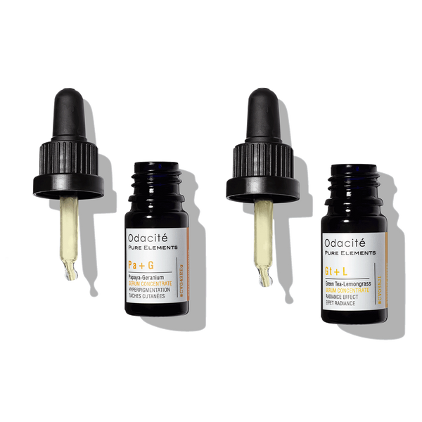 Odacite Brighten + Balance Uneven Skin Duo glass bottles with droppers off, shown on a plain white background.